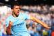 MANCHESTER, ENGLAND - SEPTEMBER 22: Sergio Aguero of Manchester City (16) celebrates as he scores their first goal during the Barclays Premier League match between Manchester City and Manchester United at the Etihad Stadium on September 22, 2013 in Manch