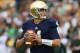 SOUTH BEND, IN - SEPTEMBER 21: Tommy Rees #11 of the Notre Dame Fighting Irish looks for a receiver against the Michigan State Spartans at Notre Dame Stadium on September 21, 2013 in South Bend, Indiana. Notre dame defeated Michigan State 17-13. (Photo