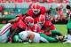 ATHENS, GA - SEPTEMBER 21: Brandin Byrd #24 and Mason Y'Barbo #57 of the North Texas Mean Green are buried by Chris Mayes #93, Amarlo Harrera #52, and Josh Harvey-Clemons #25 of the Georgia Bulldogs at Sanford Stadium on September 21, 2013 in Athens, Geor