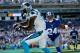 CHARLOTTE, NC - SEPTEMBER 22: Terrell Thomas #24 of the New York Giants watches as Brandon LaFell #11 of the Carolina Panthers catches a touchdown during their game at Bank of America Stadium on September 22, 2013 in Charlotte, North Carolina. (Photo