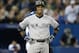 TORONTO, CANADA - SEPTEMBER 18: Robinson Cano #24 of the New York Yankees reacts after his groundball just stayed fair resulting in a groundout in the sixth inning during MLB game action against the Toronto Blue Jays on September 18, 2013 at Rogers Centre