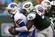 EAST RUTHERFORD, NJ - SEPTEMBER 22: Defensive end Muhammad Wilkerson #96 of the New York Jets sacks quarterback EJ Manuel #3 of the Buffalo Bills during the second quarter in a game at MetLife Stadium on September 22, 2013 in East Rutherford, New Jersey.