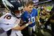 EAST RUTHERFORD, NJ - SEPTEMBER 15: Quarterback Peyton Manning #18 of the Denver Broncos and brother quarterback Eli Manning #10 of the New York Giants shake hands at the end of the Denver Broncos 41-23 win over the New York Giants at MetLife Stadium on S