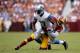 LANDOVER, MD - SEPTEMBER 22: Nate Burleson #13 of the Detroit Lions is tackled by David Amerson #39 of the Washington Redskins after catching a pass from Matthew Stafford #9 (not pictured) in the first quarter during a game at FedExField on September 22,