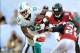 Sep 22, 2013; Miami Gardens, FL, USA; Miami Dolphins running back Daniel Thomas (33) is tackled by Atlanta Falcons free safety Thomas DeCoud (28) during the second half at Sun Life Stadium. Mandatory Credit: Steve Mitchell-USA TODAY Sports