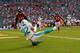MIAMI GARDENS, FL - SEPTEMBER 22: Brian Hartline #82 of the Miami Dolphins catches a touchdown pass during a game against the Atlanta Falcons at Sun Life Stadium on September 22, 2013 in Miami Gardens, Florida. (Photo by Mike Ehrmann/Getty Images)