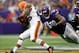 Sep 22, 2013; Minneapolis, MN, USA; Cleveland Browns running back Willis McGahee (26) gains 9 yards and breaks the tackle of Minnesota Vikings defensive tackle Letroy Guion (98) in the third quarter at Mall of America Field at H.H.H. Metrodome. The Browns