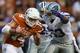 AUSTIN, TX - SEPTEMBER 21: David Ash #14 of the Texas Longhorns is tackled by Blake Slaughter #53 of the Kansas State Wildcats at Darrell K Royal-Texas Memorial Stadium on September 21, 2013 in Austin, Texas. (Photo by Ronald Martinez/Getty Images)