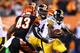 CINCINNATI, OH - SEPTEMBER 16: Running back Felix Jones #23 of the Pittsburgh Steelers runs the ball against strong safety George Iloka #43 of the Cincinnati Bengals in the first quarter at Paul Brown Stadium on September 16, 2013 in Cincinnati, Ohio. (