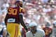 LOS ANGELES, CA - SEPTEMBER 21: Chuckie Keeton #16 of the Utah State Aggies reacts after he is knocked to the ground by George Uko #90 of the USC Trojans during a 17-14 Trojan win at the Los Angeles Memorial Coliseum on September 21, 2013 in Los Angeles,