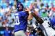 Carolina's defense was in New York quarterback Eli Manning's face all game long.