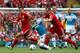 LIVERPOOL, ENGLAND - AUGUST 13: Stewart Downing and Charlie Adam of Liverpool tackle Jack Colback of Sunderland during the Barclays Premier League match between Liverpool and Sunderland at Anfield on August 13, 2011 in Liverpool, England. (Photo by Cliv