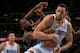 DENVER, CO - JANUARY 05: JaVale McGee #34 of the Denver Nuggets grabs a rebound away from DeMarre Carroll #3 of the Utah Jazz at the Pepsi Center on January 5, 2013 in Denver, Colorado. The Nuggets defeated the Jazz 110-91. NOTE TO USER: User expressly a