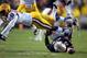 Sep 21, 2013; Baton Rouge, LA, USA; LSU Tigers cornerback Dwayne Thomas (13) leaps over Auburn Tigers wide receiver Jaylon Denson (89) as he falls to the ground for an incomplete pass in the first quarter at Tiger Stadium. Denson was injured on the play.