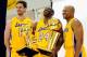 EL SEGUNDO, CA - SEPTEMBER 25: Kobe Bryant #24 of the Los Angeles Lakers laughs as he holds two NBA Finals Larry O'Brien Championship Trophy's as he poses for a photograph with teammates Pau Gasol #16 and Derek Fisher #2 during Media Day at the Toyota C