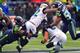 SEATTLE, WA - SEPTEMBER 22:Running back Maurice Jones-Drew #32 of the Jacksonville Jaguars is tackled by defensive tackle Brandon Mebane #92 of the Seattle Seahawks during the second quarter of the game at CenturyLink Field on September 22, 2013 in Seattl