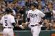 Sep 23, 2013; St. Petersburg, FL, USA; Tampa Bay Rays right fielder Wil Myers (9) is congratulated by left fielder Sam Fuld (5) after he scored a run against the Baltimore Orioles at Tropicana Field. Mandatory Credit: Kim Klement-USA TODAY Sports