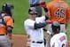 Sep 19, 2013; Cleveland, OH, USA; Cleveland Indians shortstop Asdrubal Cabrera (center) celebrates after scoring a run in the fourth inning against the Houston Astros at Progressive Field. Mandatory Credit: David Richard-USA TODAY Sports