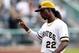 Sep 22, 2013; Pittsburgh, PA, USA; Pittsburgh Pirates center fielder Andrew McCutchen (22) reacts to a standing ovation after being removed from the game against the Cincinnati Reds during the eighth inning at PNC Park. The Reds won 11-3. Mandatory Credit