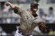 SAN DIEGO, CA - SEPTEMBER 22: Andrew Cashner #34 of the San Diego Padres pitches during the second inning of a baseball game against the Los Angeles Dodgers at Petco Park on September 22, 2013 in San Diego, California. (Photo by Denis Poroy/Getty Images