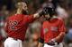 BOSTON, MA - AUGUST 30: Shane Victorino #18 of the Boston Red Sox is tapped on the helmet by teammate Mike Napoli #12 after scoring during the fourth inning against the Chicago White Sox at Fenway Park on August 30, 2013 in Boston, Massachusetts. (Photo