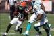 Sep 8, 2013; Cleveland, OH, USA; Cleveland Browns wide receiver Travis Benjamin (80) after a pass reception against Miami Dolphins cornerback Nolan Carroll (28) and outside linebacker Koa Misi (55) during the third quarter at FirstEnergy Field. The Dolphi