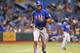 ST. PETERSBURG, FL - SEPTEMBER 16: Outfielder Alex Rios #51 of the Texas Rangers scores against the Tampa Bay Rays September 16, 2013 at Tropicana Field in St. Petersburg, Florida. (Photo by Al Messerschmidt/Getty Images)