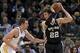 April 15, 2013; Oakland, CA, USA; San Antonio Spurs center Tiago Splitter (22) controls the ball against Golden State Warriors power forward David Lee (10) during the first quarter at Oracle Arena. Mandatory Credit: Kelley L Cox-USA TODAY Sports
