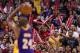 LOS ANGELES, CA - APRIL 07: Fans of the Los Angeles Lakers and Los Angeles Clippers cheer as Kobe Bryant #24 takes a free throw shot during the NBA game at Staples Center on April 7, 2013 in Los Angeles, California. The Clippers defeated the Lakers 109-