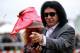 BALTIMORE, MD - MAY 18: Musician Gene Simmons (R) and his wife Shannon Tweed (L) attend the 138th running of the Preakness Stakes at Pimlico Race Course on May 18, 2013 in Baltimore, Maryland. (Photo by Justin Heiman/Getty Images)