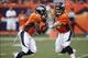 Aug 24, 2013; Denver, CO, USA; Denver Broncos quarterback Peyton Manning (18) hands off to running back Ronnie Hillman (21) during the first quarter against the St. Louis Rams at Sports Authority Field at Mile High. Mandatory Credit: Chris Humphreys-USA T