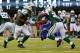Sep 22, 2013; East Rutherford, NJ, USA; New York Jets quarterback Geno Smith (7) hands off to running back Bilal Powell (29) during the third quarter against the Buffalo Bills at MetLife Stadium. Mandatory Credit: Anthony Gruppuso-USA TODAY Sports