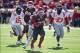 Oct 27, 2012; Little Rock, AR, USA; Arkansas Razorback running back Dennis Johnson (33) gets past Ole Miss Rebel linebacker Joel Knight (15) and defensive end E.J. Epperson (33) during a game at War Memorial Stadium. Ole Miss defeated Arkansas 30-27. Mand