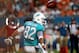 MIAMI GARDENS, FL - AUGUST 24: Wide receiver Brian Hartline #82 of the Miami Dolphins cannot make a catch against the Tampa Bay Buccaneers at Sun Life Stadium on August 24, 2013 in Miami Gardens, Florida. (Photo by Marc Serota/Getty Images)