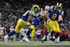 December 2, 2012; St. Louis, MO, USA; St. Louis Rams quarterback Sam Bradford (8) hands off to running back Daryl Richardson (26) during the first half at the Edward Jones Dome. St. Louis defeated San Francisco 16-13 in overtime. Mandatory Credit: Jeff Cu