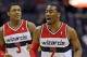 Jan 14, 2013; Washington, DC, USA; Washington Wizards point guard John Wall (2) and shooting guard Bradley Beal (3) react against the Orlando Magic during the second half at the Verizon Center. The Wizards defeated the Magic 120 - 91. Mandatory Credit: Br