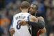 Dec 30, 2011; Minneapolis, MN, USA: Miami Heat guard Dwyane Wade (right) hugs Minnesota Timberwolves forward Michael Beasley (8) during the first half at Target Center. Mandatory Credit: Jesse Johnson-USA TODAY Sports