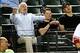 Aug. 12, 2013; Phoenix, AZ, USA: Arizona senator John McCain (left) reacts in the grandstands to an umpires call during the game between the Arizona Diamondbacks against the Baltimore Orioles at Chase Field. Mandatory Credit: Mark J. Rebilas-USA TODAY Spo