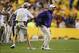 Sep 21, 2013; Baton Rouge, LA, USA; LSU Tigers head coach Les Miles is pulled back to the sidelines as he reacts to a call in the second half against the Auburn Tigers at Tiger Stadium. LSU defeated Auburn 35-21. Mandatory Credit: Crystal LoGiudice-USA TO