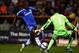 Ramires slips the ball past the onrushing Wes Foderingham.