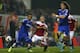 SWINDON, ENGLAND - SEPTEMBER 24: Alex Pritchard (2L) of Swindon Town is held back by Ryan Bertrand (L) as David Luiz (R) closes in of Chelsea during the Capital One Cup third round match between Swindon Town and Chelsea at the County Ground on September 2