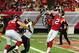 ATLANTA, GA - SEPTEMBER 15: Matt Ryan #2 of the Atlanta Falcons passes despite pressure fom Robert Quinn #94 of the St. Louis Rams at the Georgia Dome on September 15, 2013 in Atlanta, Georgia. (Photo by Scott Cunningham/Getty Images)