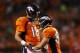 DENVER, CO - SEPTEMBER 23: Peyton Manning #18 and Wes Welker #83 of the Denver Broncos celebrate their second quarter touchdown against the Oakland Raiders at Sports Authority Field at Mile High on September 23, 2013 in Denver, Colorado. (Photo by Jus