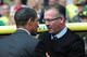 NORWICH, ENGLAND - SEPTEMBER 21: Paul Lambert of Aston Villa greets Chris Houghton of Norwich City during the Barclays Premier League match between Norwich City and Aston Villa at Carrow Road on September 21, 2013 in Norwich, England. (Photo by Jamie Mc