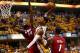 INDIANAPOLIS, IN - JUNE 01: Paul George #24 of the Indiana Pacers dunks the ball against Joel Anthony #50 and Chris Bosh #1 of the Miami Heat in Game Six of the Eastern Conference Finals during the 2013 NBA Playoffs at Bankers Life Fieldhouse on June 1,