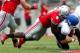 COLUMBUS, OH - AUGUST 31: Noah Spence #8 of the Ohio State Buckeyes sacks Joe Licata #16 of the Buffalo Bulls during the third quarter on August 31, 2013 at Ohio Stadium in Columbus, Ohio. Ohio State defeated Buffalo 40-20. (Photo by Kirk Irwin/Getty Ima