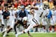 LINCOLN, NE - SEPTEMBER 14: Wide receiver Shaquelle Evans #1 of the UCLA Bruins slips past cornerback Ciante Evans #17 of the Nebraska Cornhuskers during their game at Memorial Stadium on September 14, 2013 in Lincoln, Nebraska. (Photo by Eric Francis/Get
