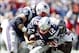 Sep 22, 2013; Foxborough, MA, USA; New England Patriots quarterback Tom Brady (12) is sacked by Tampa Bay Buccaneers outside linebacker Lavonte David (right) during the first half at Gillette Stadium. Mandatory Credit: Mark L. Baer-USA TODAY Sports