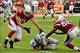 Sep 15, 2013; Phoenix, AZ, USA; Detroit Lions quarterback Matthew Stafford (9) slides as Arizona Cardinals defensive end Matt Shaughnessy (91) and inside linebacker Karlos Dansby (56) defend during the second half at University of Phoenix Stadium. Mandato