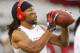 GLENDALE, AZ - OCTOBER 29: Larry Fitzgerald # 11 of the Arizona Cardinals listens to music as he catches passes during pre-game warm-ups before the start of an NFL game against the San Francisco 49ers at University of Phoenix Stadium on October 29, 2012 i